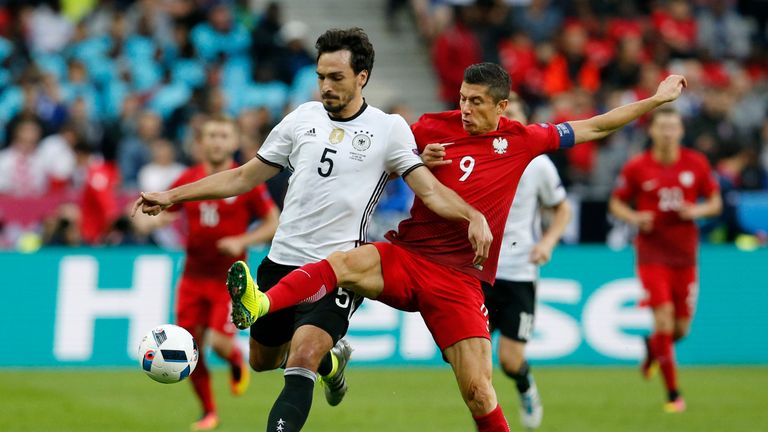 Poland's Robert Lewandowski, right, challenges Germany's Mats Hummels during the Euro 2016 Group C soccer match 