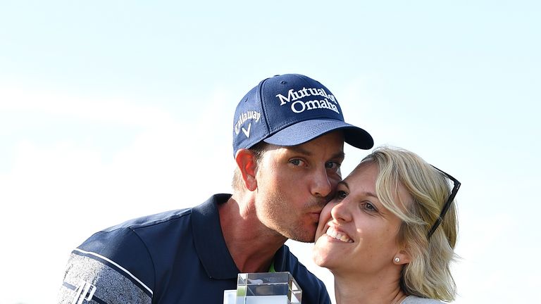 Henrik Stenson of Sweden celebrates his victory with wife Emma and the trophy after the final round of the BMW International Open