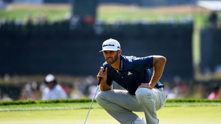 Dustin Johnson lines up a putt in the final round