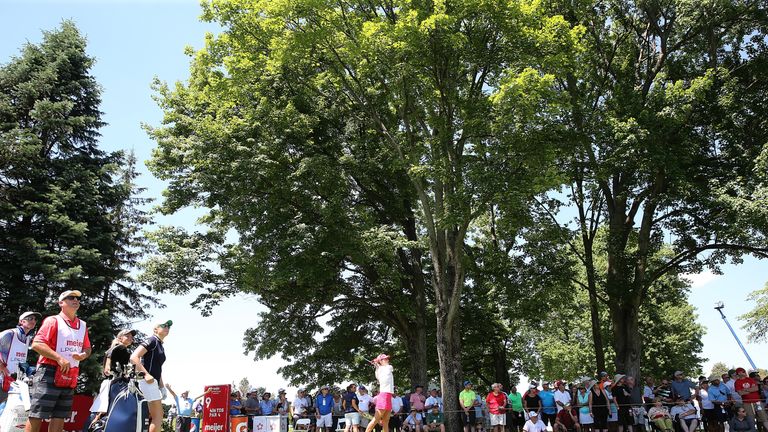 Thompson is leading, despite struggling through back pain