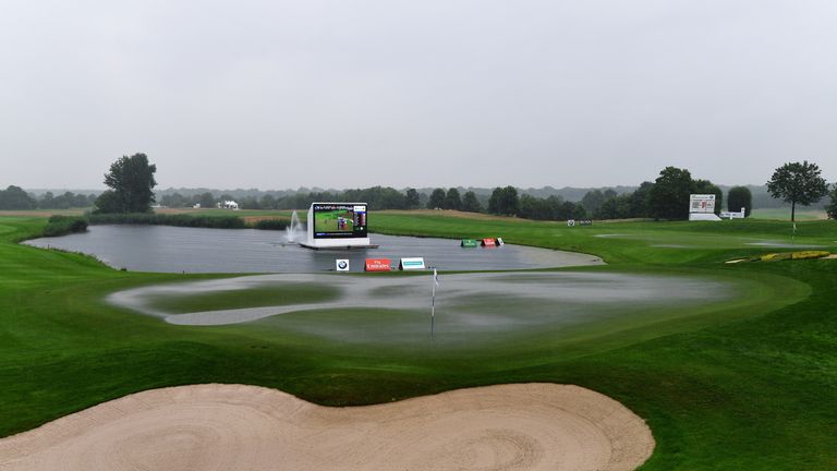 A general view of the flooded 18th green during the suspention of play during the third round of the BMW International Open