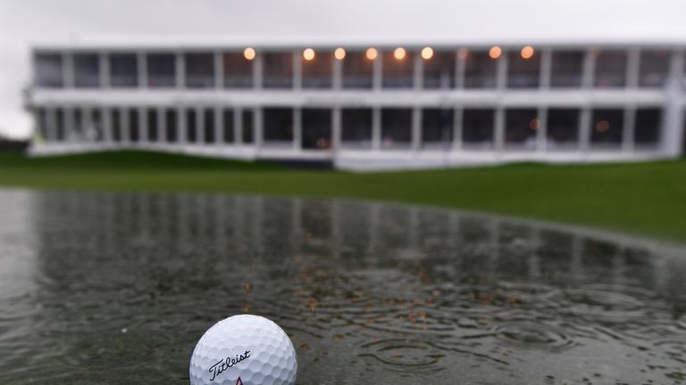 A ball lays in the water on the flooded 18th green during the suspension of play during the third round of the BMW International OPen