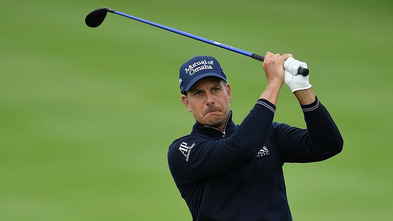 Henrik Stenson of Sweden hits an approach shot during the rain delayed third round of the BMW International Open