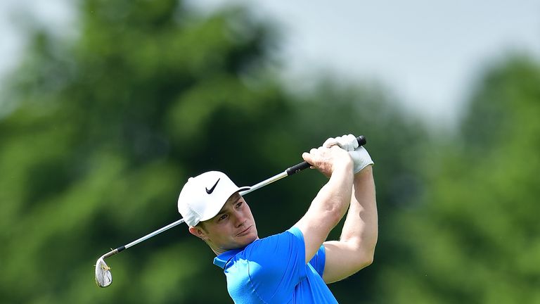 Oliver Fisher of England hits an aproach during the first round of the BMW International Open at Gut Larchenhof on June 23