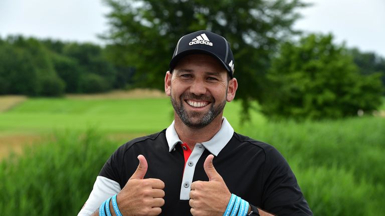 Sergio Garcia of Spain celebrates his Hilton Hotels prize after his hole in one on the 11th hole during the second round of the BMW International