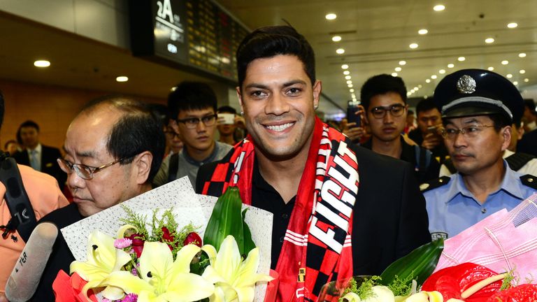 Brazil's Hulk makes his way through the arrivals halls at Shanghai Pudong International Airport
