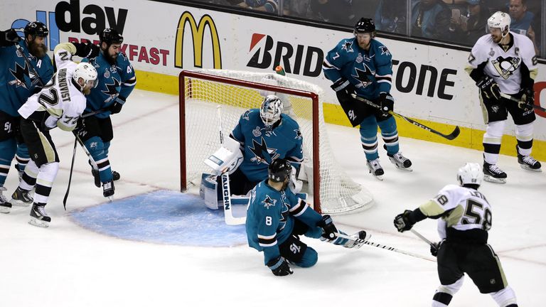 Martin Jones #31 of the San Jose Sharks allows a goal to Kris Letang #58 of the Pittsburgh Penguins in the second period