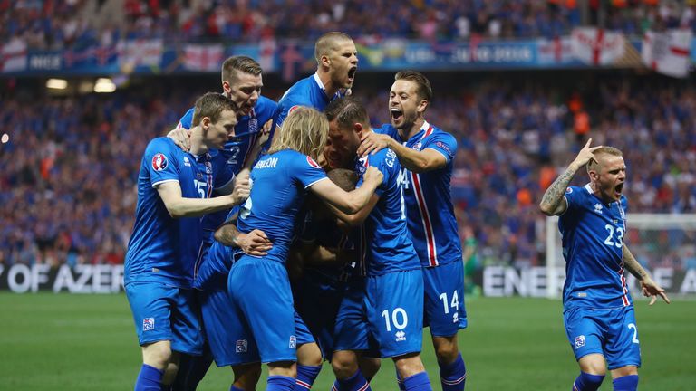 Ragnar Sigurdsson (C, obscured) of Iceland celebrates scoring his team's first goal 
