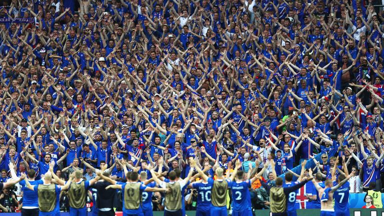 Iceland players and fans celebrate at the Stade de France