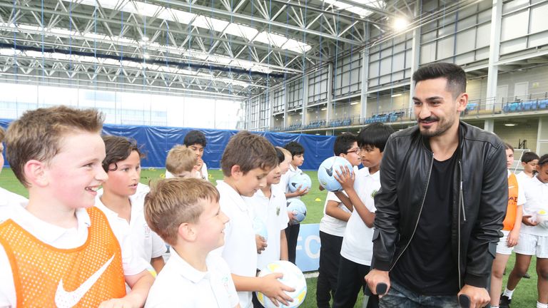 Manchester City's Ilkay Gundogan visits CITC children