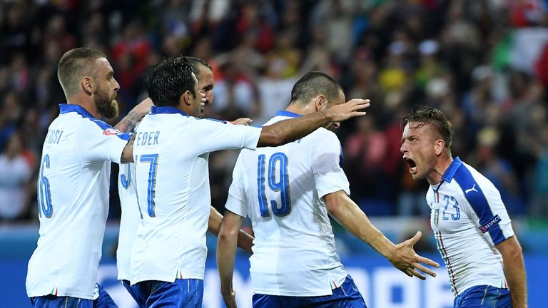 Italy's midfielder Emanuele Giaccherini (R) celebrates with teammates after scoring during the Euro 2016 group E football match between Belgium and Italy a