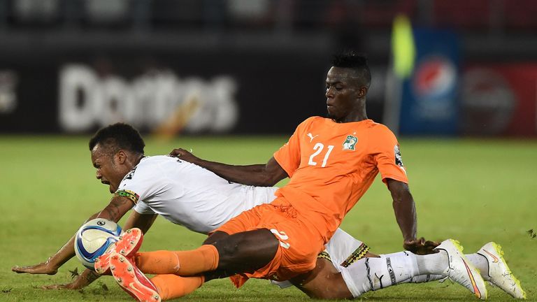 Ivory Coast's defender Eric Bailly challenges Ghana's forward Jordan Ayew (back) during the 2015 African Cup of Nations final in February 2015