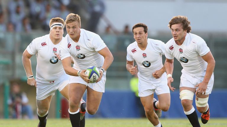 Jack Walker of England runs with the ball with team mates Paul Hill (L), James Mitchell and Will Owen (R) in  the 2015 World Rugby U20s Championship 