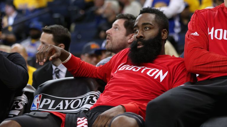 James Harden #13 of the Houston Rockets sits on the bench during the final minutes of their loss to the Golden State Warriors in G