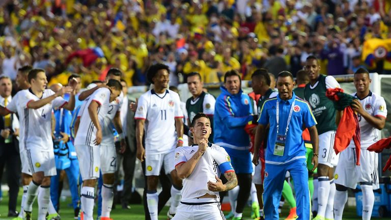 Colombia's James Rodriguez (c) celebrates after scoring