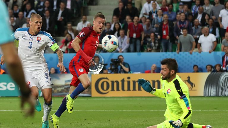 Matus Kozacik of Slovakia saves a shot from England's Jamie Vardy of England during Group B clash