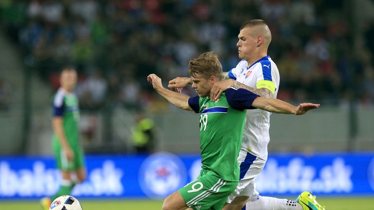 Slovakia's Martin Skrtel (right) and Northern Ireland's Jamie Ward battle for the ball during the International Friendly match at the Antona Malatinskeho S