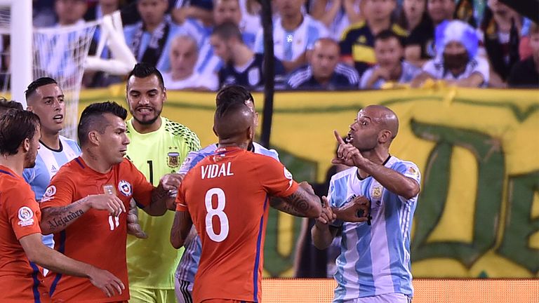 An ill-tempered match saw eight yellow cards - including for Argentina's Javier Mascherano (R) and Chile's Arturo Vidal - as well as two reds