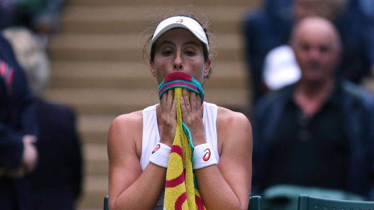 Britain's Johanna Konta wipes her face during a break in her women's singles second round match against Canada's Eugenie Bouchard on the fourth day of the 