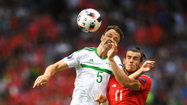 Jonny Evans of Northern Ireland and Gareth Bale of Wales compete for the ball during the Euro 2016 last-16 tie