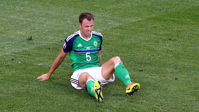 Jonny Evans looks dejected after Northern Ireland's defat to Poland