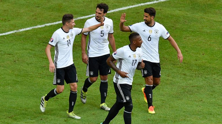 Germany midfielder Julian Draxler (left) celebrates with team-mates after scoring 