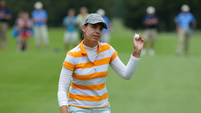 Karine Icher of France waves to the crowd after finishing her round on the 18th hole during the final round of the ShopRite LPGA Classic