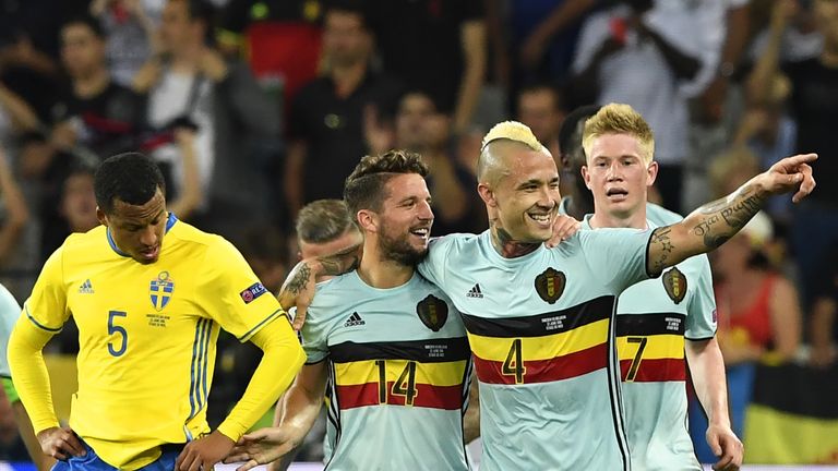 Belgium midfielder Radja Nainggolan celebrates a goal with forward Dries Mertens and Kevin De Bruyne