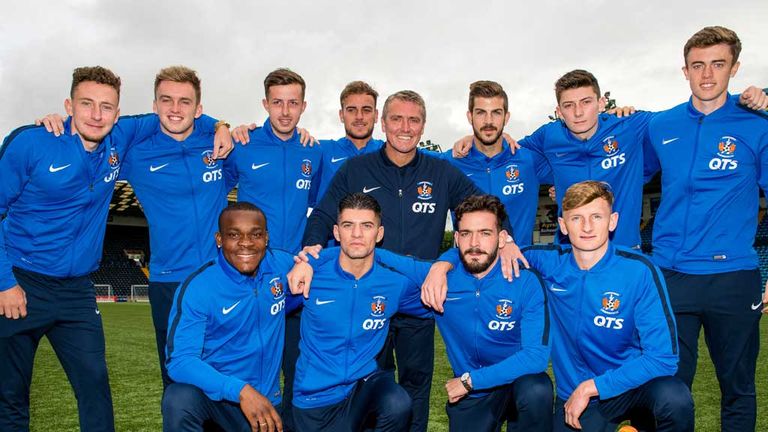 Kilmarnock manager Lee Clark (centre standing) unveils his eleven new players at Rugby Park