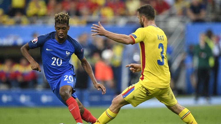 France's forward Kingsley Coman vies for the ball with Romania's defender Razvan Rat during the Euro 2016 group A football match between France and Romania