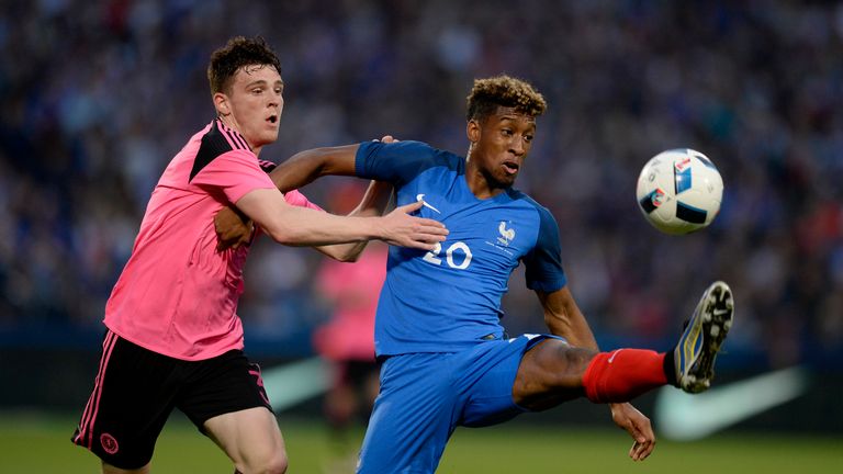 METZ, FRANCE - JUNE 04: Kingsley Coman of France (R) is challenged by Charlie Mulgrew of Scotland during the International Friendly between France and Scot
