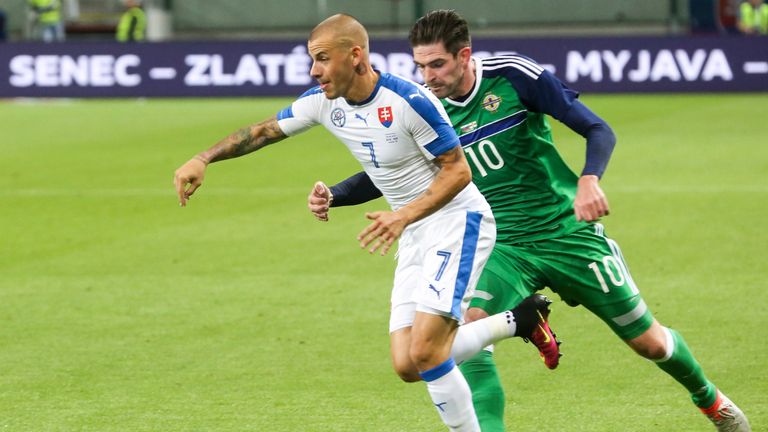Slovakia's Vladimir Weiss (left) pulls away from Northern Ireland striker Kyle Lafferty