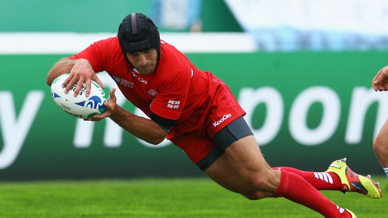 Lasha Khmaladze of Georgia goes over to score a try