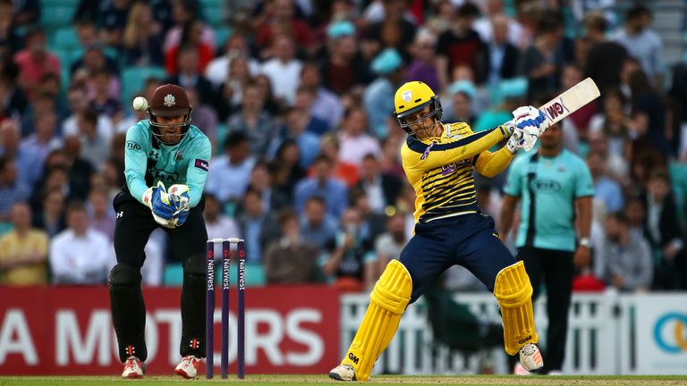 LONDON, ENGLAND - JUNE 09: Lewis McManus of Hampshire hits out while Ben Foakes of Surrey looks on during the NatWest T20 Blast match between Surrey and Ha