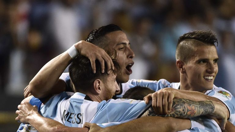 Argentina's Lionel Messi (L) celebrates with teammates