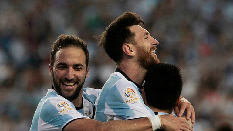 Messi celebrates with teammates Gonzalo Higuain and Nicolas Gaitan  after scoring the third goal of the game in their Copa America quarter-final