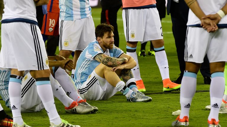 Argentina's Lionel Messi sits on the ground in dejection after being defeated by Chile in the penalty shoot-out of the Copa America Centenario final in Eas
