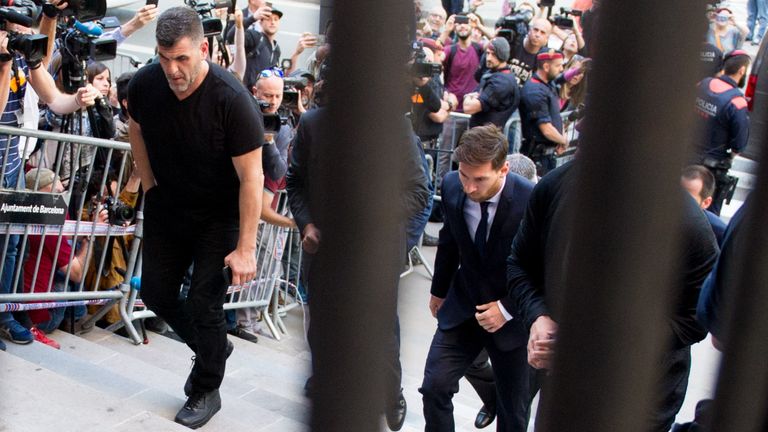Lionel Messi heads up the steps to take the stand in a Barcelona court