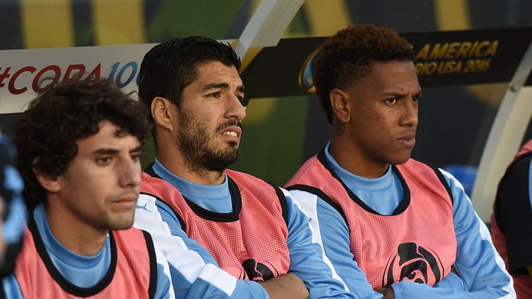 (L-R) Uruguay's Mathias Corujo, Luis Suarez and Abel Hernandez on the substitute's bench