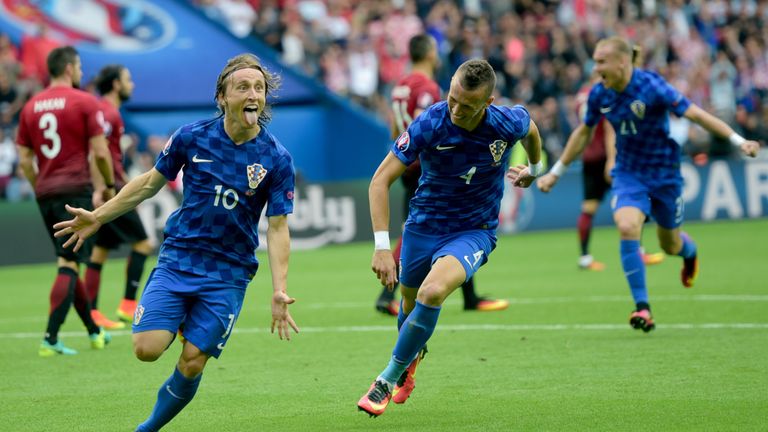 Croatia's midfielder Luka Modric (L) celebrates their first goal during the Euro 2016 group D football match between Turkey and Croatia at Parc des Princes