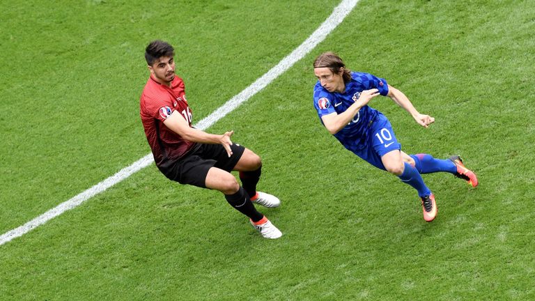 Turkey's midfielder Ozan Tufan (L) vies for the ball against Croatia's midfielder Luka Modric