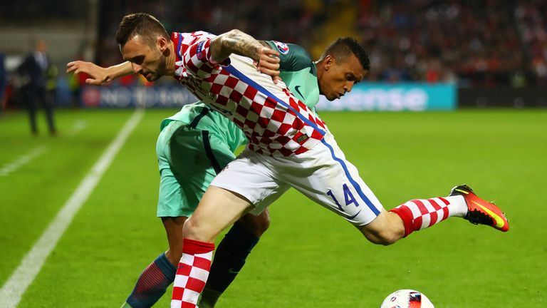 Marcelo Brozovic of Croatia and Nani of Portugal compete for the ball