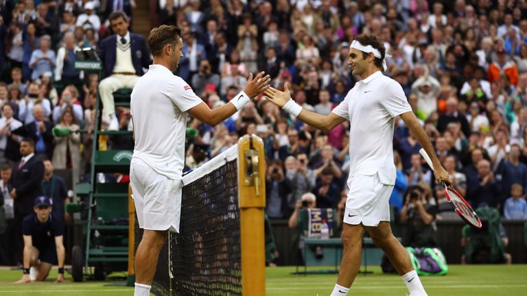 Marcus Willis of Great Britain and Roger Federer of Switzerland