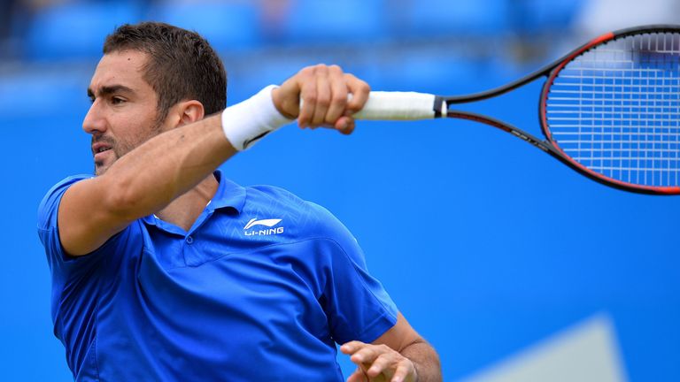 Croatia's Marin Cilic returns against Steve Johnson of the US during his men's singles quarter-final match at the ATP Aegon Championships tennis tournament