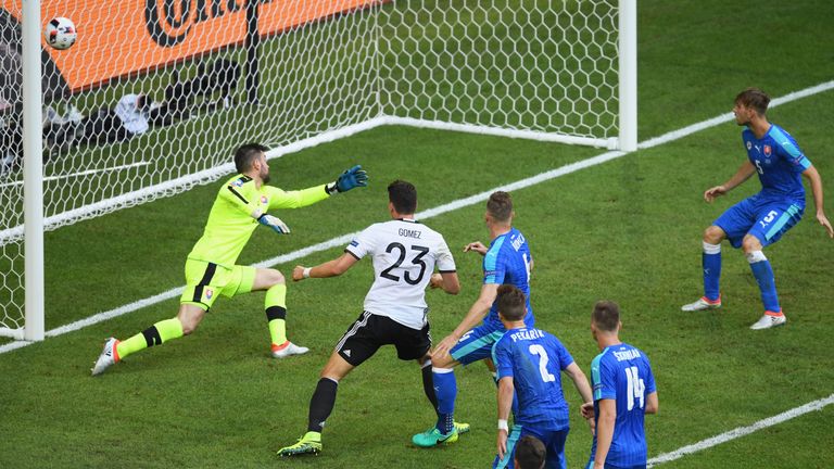 LILLE, FRANCE - JUNE 26:  Mario Gomez (2nd L) of Germany scores his team's second goal past Matus Kozacik (1st L) of Slovakia during the UEFA EURO 2016 rou