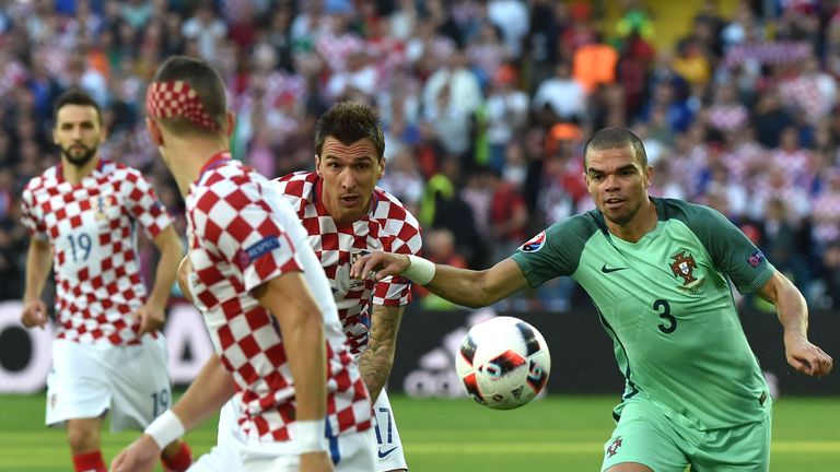 Portugal's defender Pepe (right) vies with Croatia's forward Mario Mandzukic