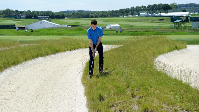 Daily Telegraph writer Mark Hughes attempts to extract his ball from the famous Church Pews on the third hole