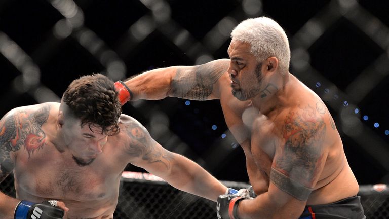 Mark Hunt delivers the knock out punch against Frank Mir during their UFC Heavyweight Bout at UFC Brisbane on March 20, 20