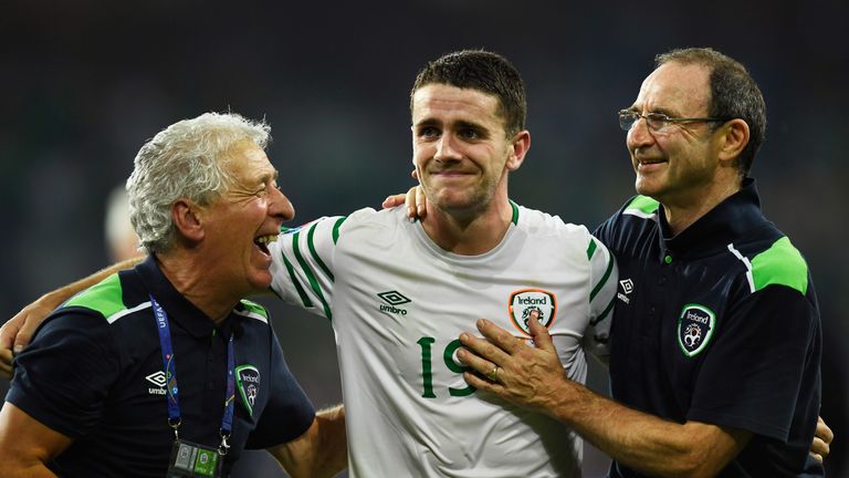 Robbie Brady (C) of Republic of Ireland is congratulated by Martin O'Neill (R)