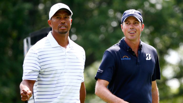 AKRON, OH - JULY 30:  Tiger Woods (L) and Matt Kuchar walk down the third hole during a practice round for the World Golf Championships-Bridgestone Invitat